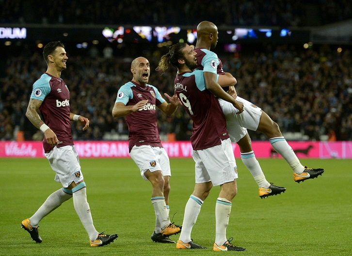 Andre Ayew celebrates scoring against Huddersfield Town