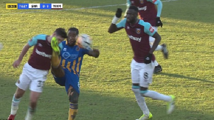 Josh Cullen receives a kick in the mouth from Abu Agogo