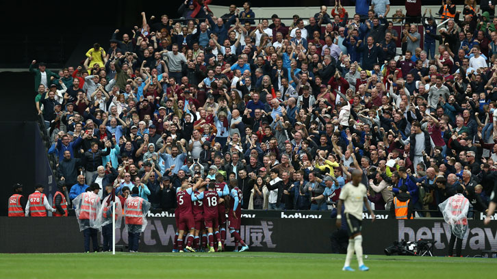 Supporters celebrate v Man U
