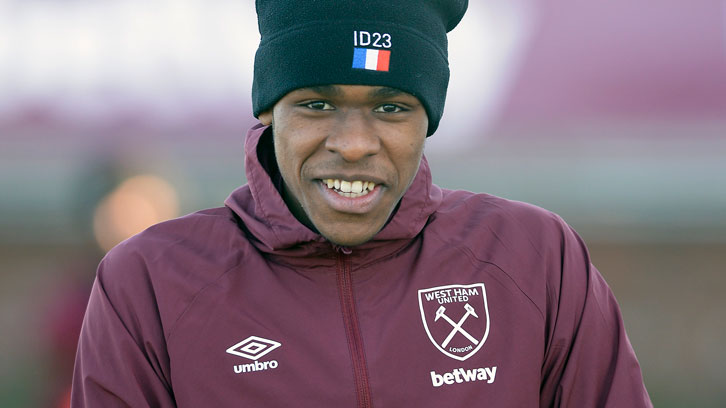 Issa Diop smiles in training at Rush Green