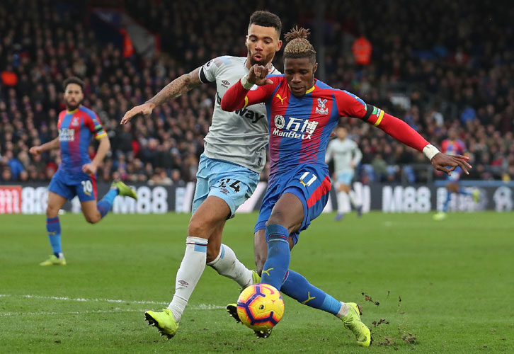 Ryan Fredericks challenges Wilfried Zaha