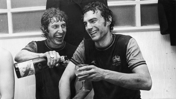 Pat Holland and Trevor Brooking celebrate