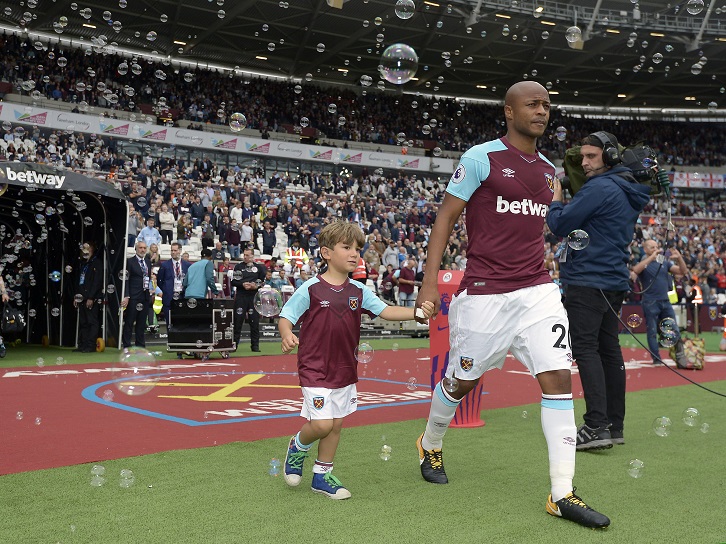 Duarte Buzio takes to the pitch with Andre Ayew