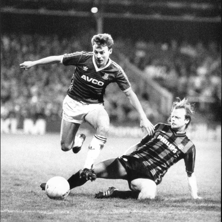 Mark Ward rides a challenge against Manchester City