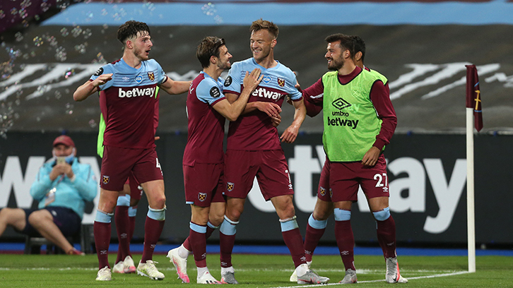 Cresswell celebrates with Yarmolenko and team-mates