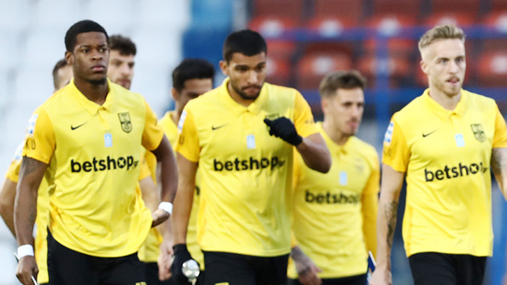 Xande Silva (left) playing for Aris FC